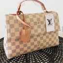 Bolsa LV baú tampa